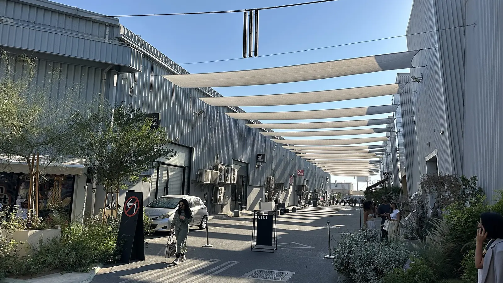 Shaded walkway between converted warehouses at Alserkal Avenue in Al Quoz, Dubai